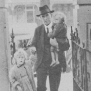 A Brother of St Vincent de Paul Society arriving at St Anthony's, 13 Palace Street, Petersham with his precious neglected children, 1923